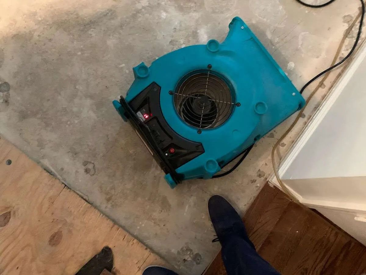 Air mover drying subfloor during Commercial Water Damage Restoration in Rhinelander